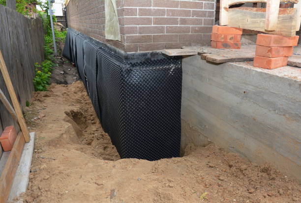 SJ Waterproofing Pros technician performing targeted Wet Basement Repair assessment in Metamora, OH
